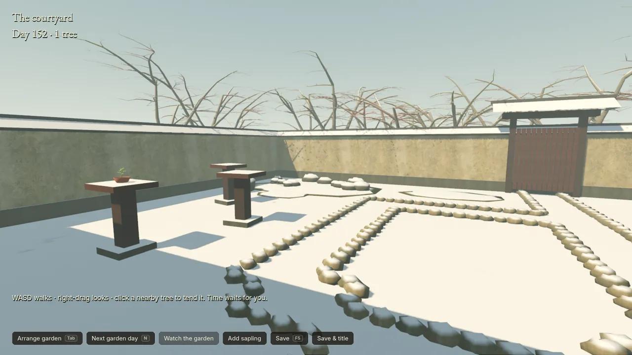 The courtyard in January: snow on the ground, the pedestals and the wall caps, the maples bare behind the walls.