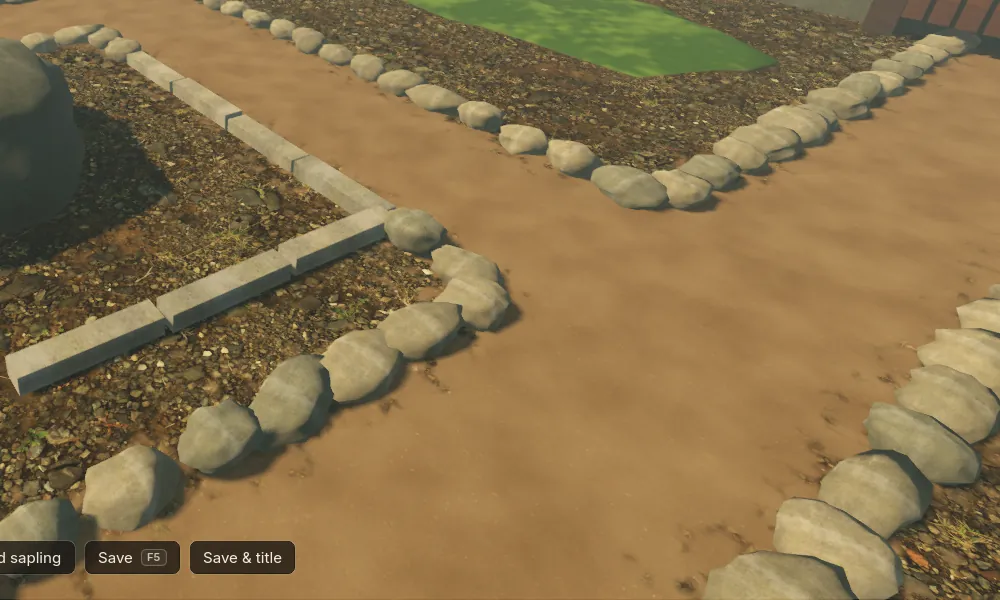 The same close view: rounded stones of varied shape, size and angle along the path, the cut kerbs unchanged.