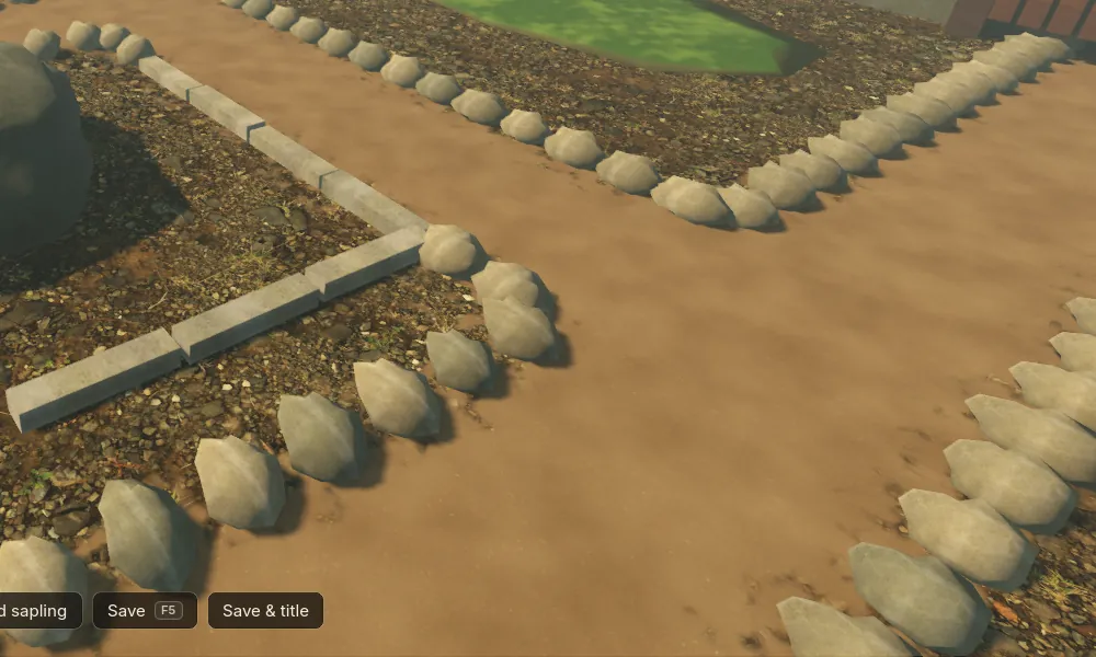 Close view of a path's edging beside the new kerbs: rows of identical faceted stones all pointing along the path.